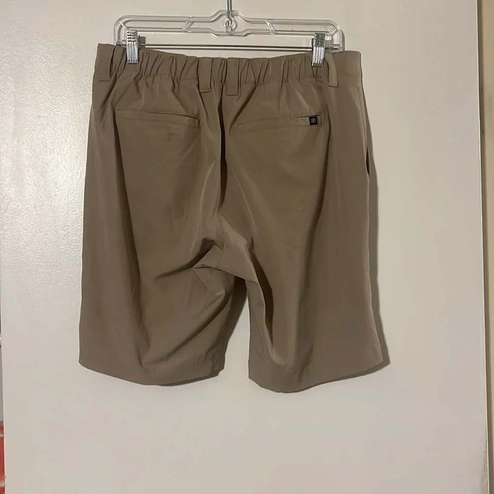 Banana Republic flat front tan shorts. Back elastic waist for comfort.